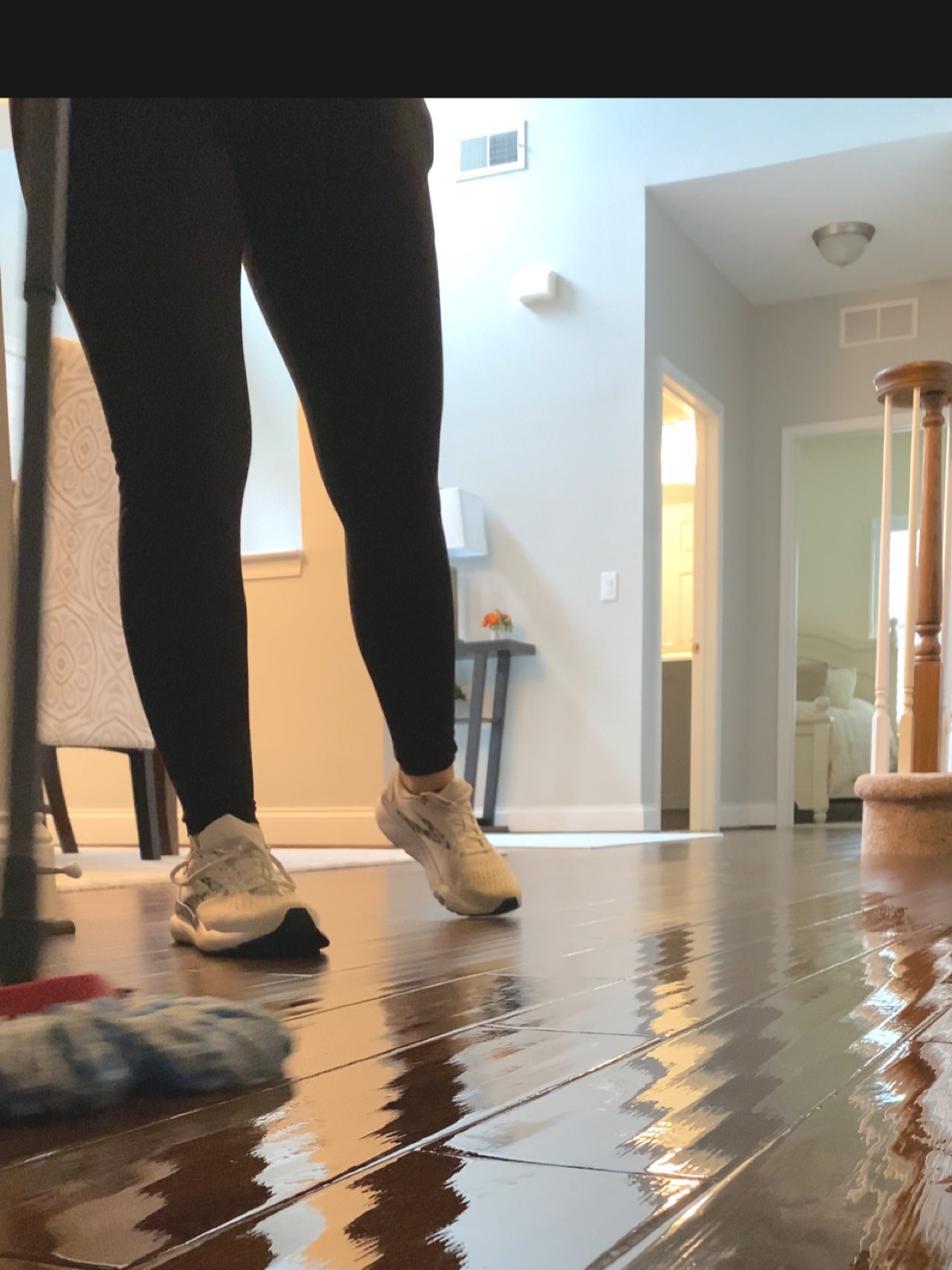 A TipTop cleaner mopping a floor