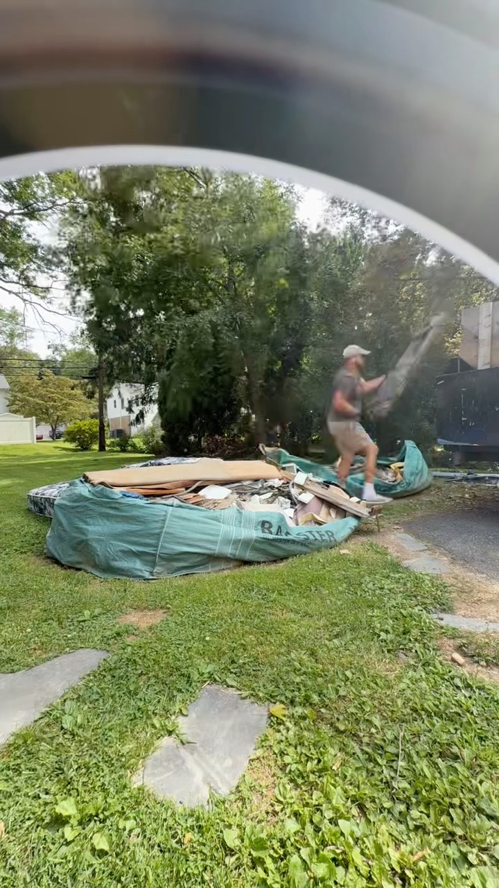 Emptying a dumpster bag