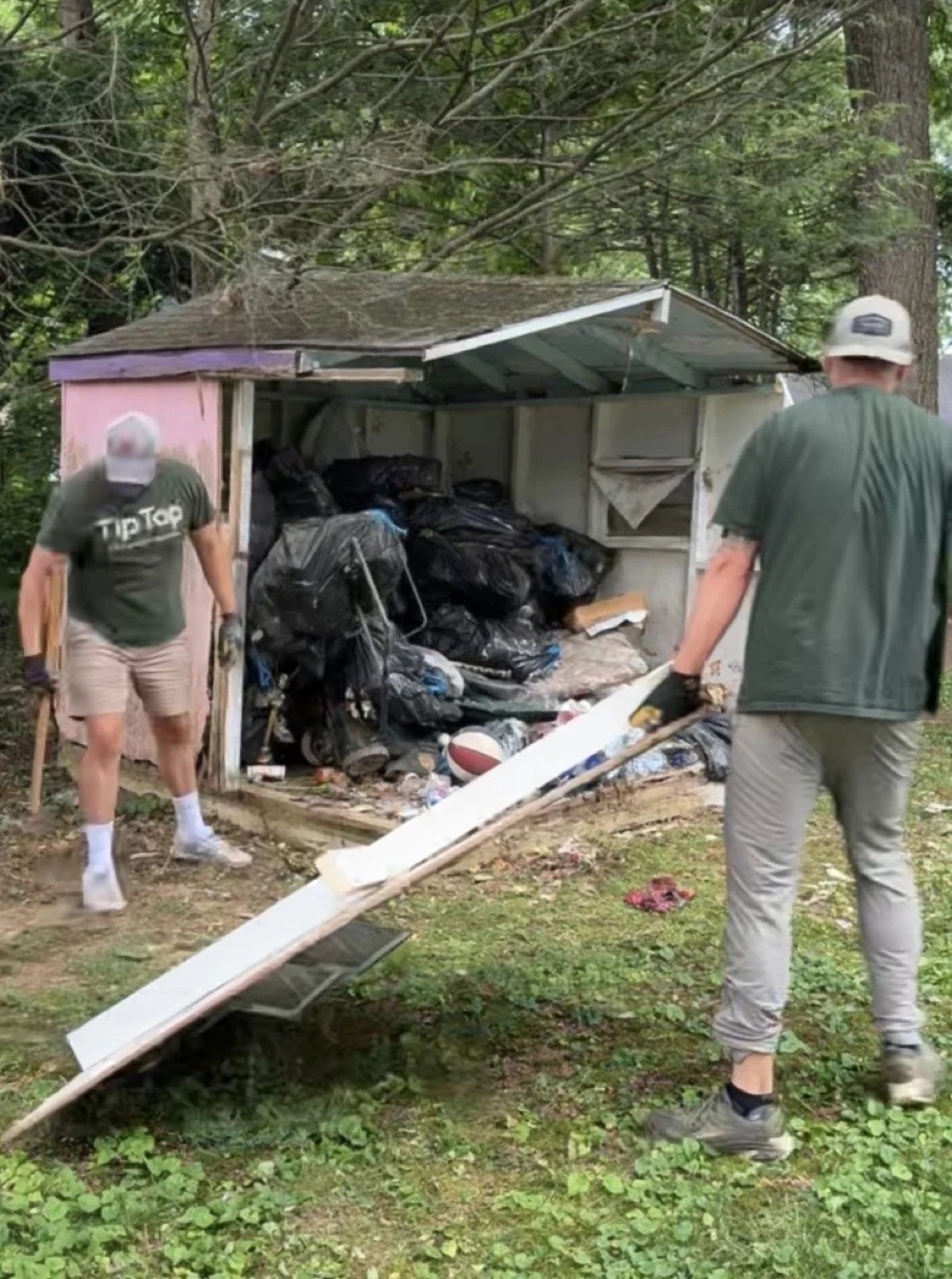 TipTop crew taking down and hauling a shed